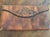 Beautiful antique Meeker leather handbag featuring intricate hand-tooled floral decoration and a warm, rich brown leather...