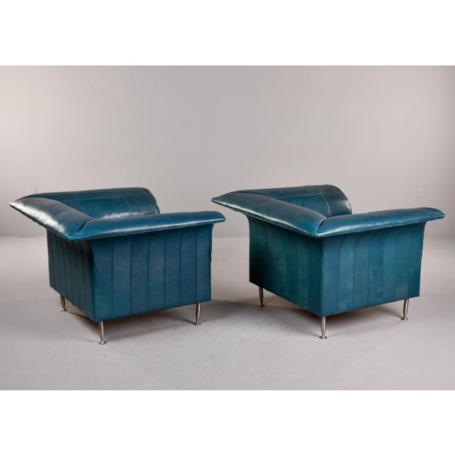 Found in Italy, this pair of sculptural leather covered chairs by Poltrona Frau date from the 1980s. Chairs have a cubist...