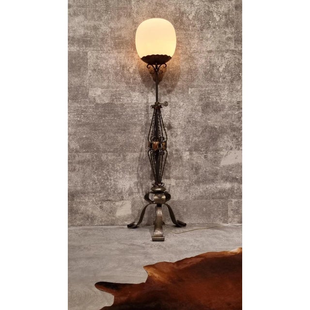 Medieval Dutch revival standing floor lamp. Renewed with glass light ball on top. European Plug (up to 250V).The wiring of...