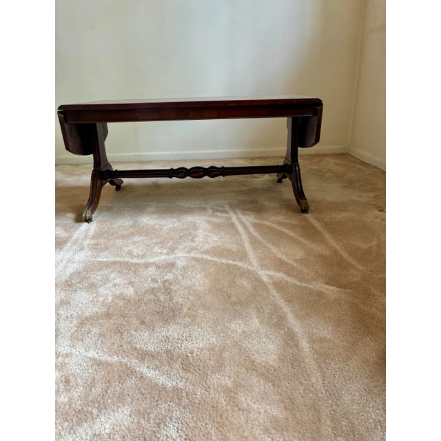 Vintage Dark Wood Coffee Table With Brass Claw Wheels For Sale In Phoenix - Image 6 of 9