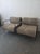 This set includes two stylish lounge chairs featuring a sturdy black metal frame and a unique rope design for the seat and...
