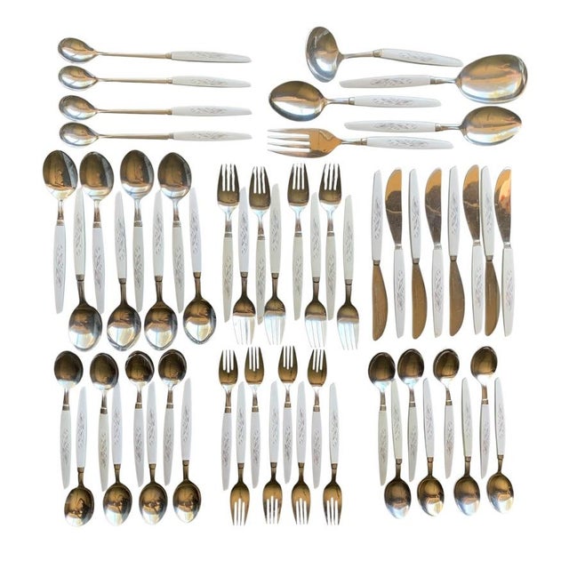 Kaysons' 1960s Lily of the Valley stainless flatware set, also referred to as Golden Rhapsody. This MCM set of 57 pcs...