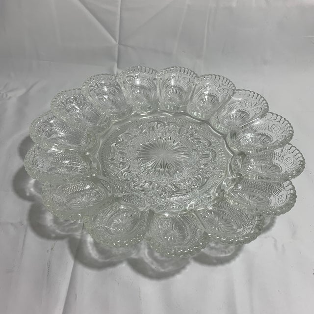 This clear pressed glass deviled egg platter is a vintage American Concord pattern piece originally produced by the...