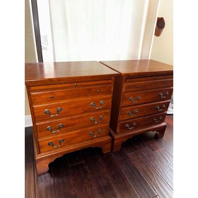 Keller Furniture Co. solid oak/wood nightstands. 24"W × 16"D × 28"H. One of the nightstand drawers is lined with green...
