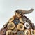 The Lega Bwami Society hat was crafted in the eastern regions of the Democratic Republic of Congo. This woven, palm fiber...