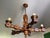 1960s wooden pendant light, 5 arms, bronze shade, suspended by a chain (23 cm). The woodwork is typical of the Basque...
