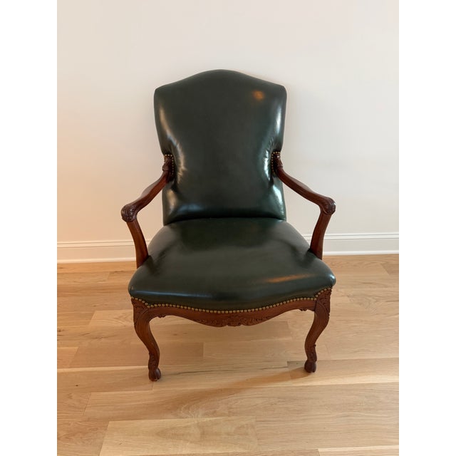 Anglo-French Louis XV interpretation. Cabriole legs with carved details, front hoofed feet. Curved arms and backrest.