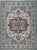 A hand-knotted wool rug, made in India and measuring 9' x 12'. A centre medallion anchoring the field, framed by a...