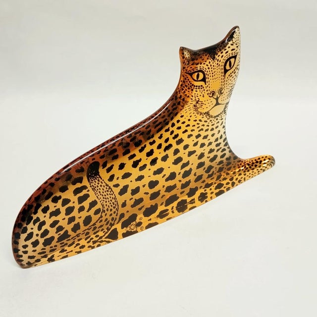 A large Abraham Palatnik (Brazil) leopard sculpture with a black abstract encased print which is accented when light...