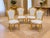 This striking set of four late 20th-century Italian Baroque Revival dining chairs combines dramatic sculptural carving...