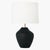Handcrafted in ceramic, the Cadley one-light table lamp by Hable features a uniquely shaped base in a black or white...
