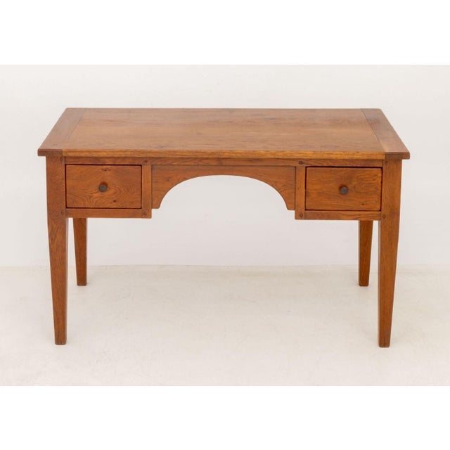 Arts and Crafts Style Oak Desk, with two short drawers on each side above four tapered legs. 30.25" H x 52.75" W x 27.25"...
