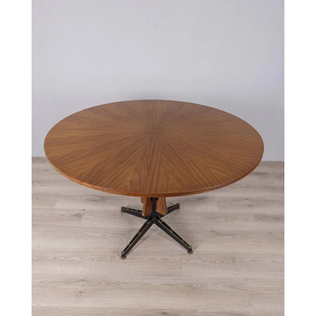 Round table with black metal frame and gold-plated brass feet, veneered wood top, designed by Carlo Ratti for Lissoni,...