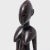 With ripe curves, refined facial features, and etched scarification marks along the torso, this female figure embodies the...
