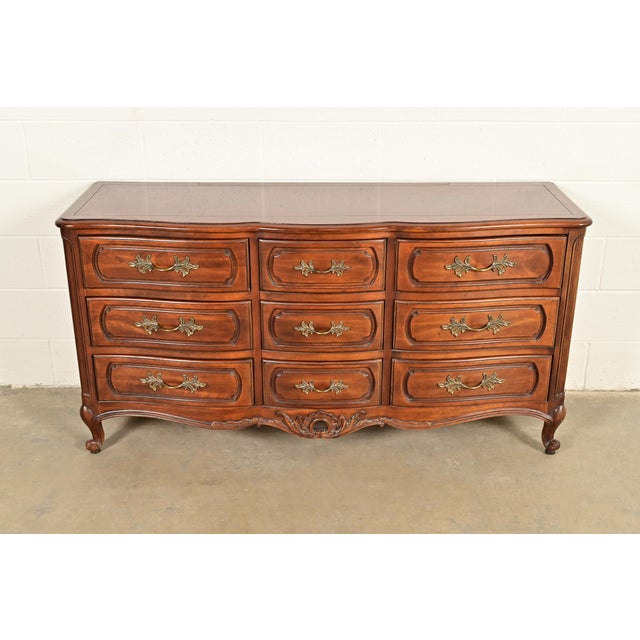 A beautiful French Provincial Louis XV style nine-drawer triple dresser or credenza By Century Furniture USA, Circa Late...