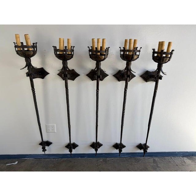 This striking set of five vintage wrought iron sconces comes from a historic landmark home in Hancock Park, a neighborhood...