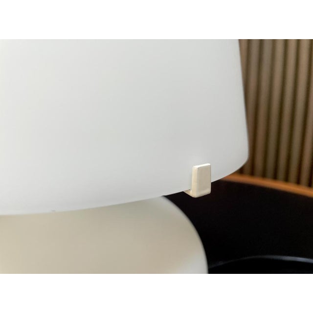 This is an iconic model 1853 table lamp from the early edition manufactured by fontana arte in italy. It was designed by...