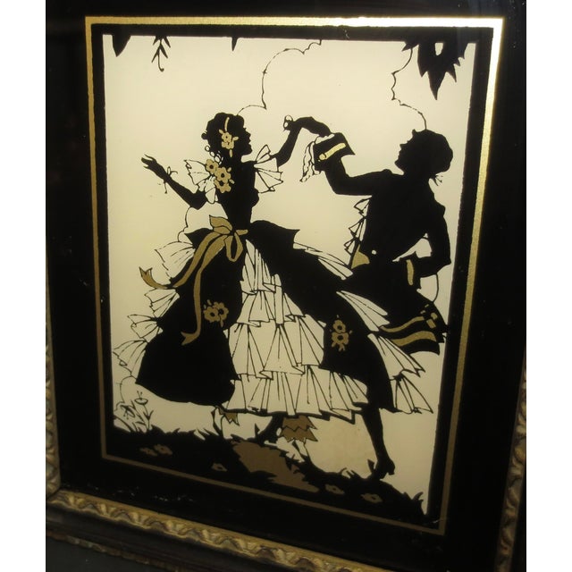 Black Enamel and shining gold create the image. a clear silhouette of a sailing boat, and a dancing Couple. Lovely with...