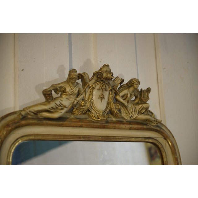 Antique Louis-Philippe style mirror (19th century), in a vertical format, elegant and timeless. The frame is made of...