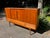 Designed by Johannes Andersen, this Danish modern teak highboard is a beautiful example of Scandinavian craftsmanship with...