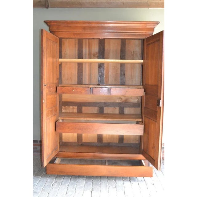 19th-century French oak Louis Philippe cabinet. It is 224 cm high, 162 cm wide, and 64 cm deep. Behind the doors are...