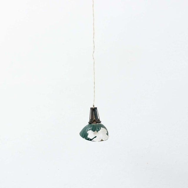 French vintage green glass ceiling lamp. By unknown manufacturer from france, circa 1940. In original condition, with...
