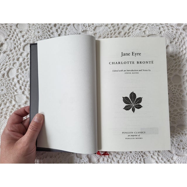 Jane Eyre by Charlotte Bronte, printed by Penguin Classics. This beautiful classic doubles as a decorative book. It...