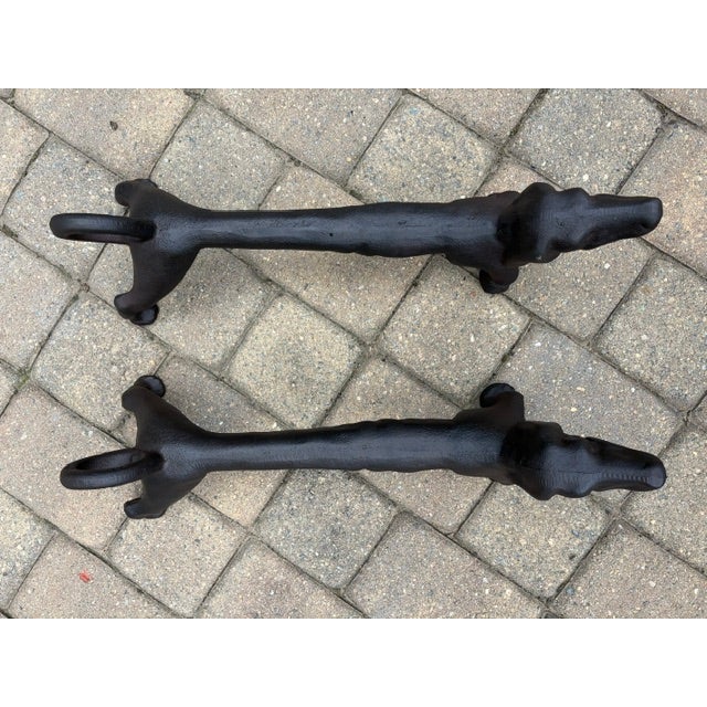 Pair of Early 20th Century Dachshund Cast Iron Andirons from around the 1920s-1930s solid black in excellent condition and...