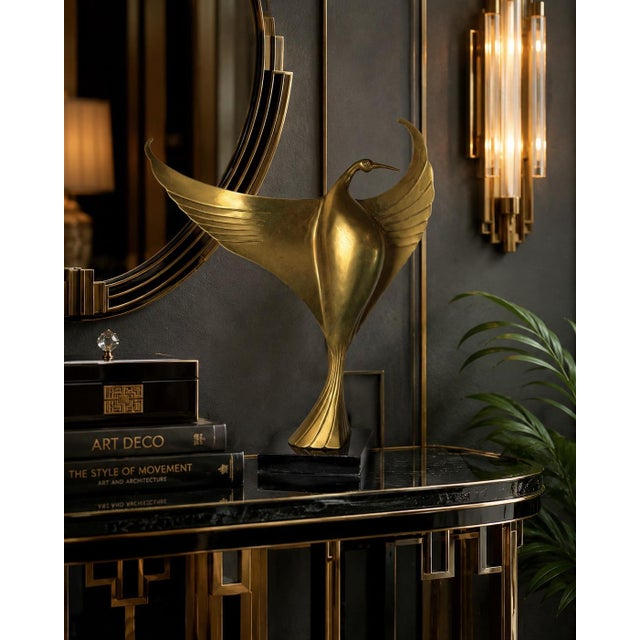 Graceful and sculptural, this 1980s Art Deco style brass bird sculpture captures the elegance of a crane in flight with...