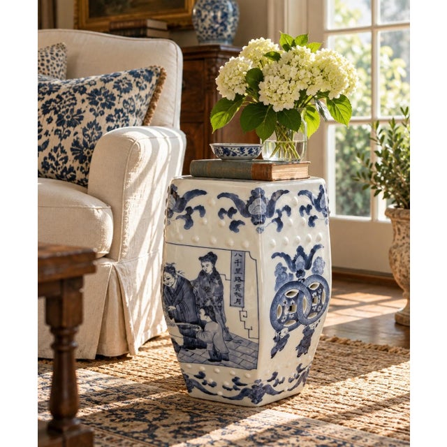 A classic blue and white porcelain garden stool, decorated with traditional Chinese motifs and stylized floral elements....