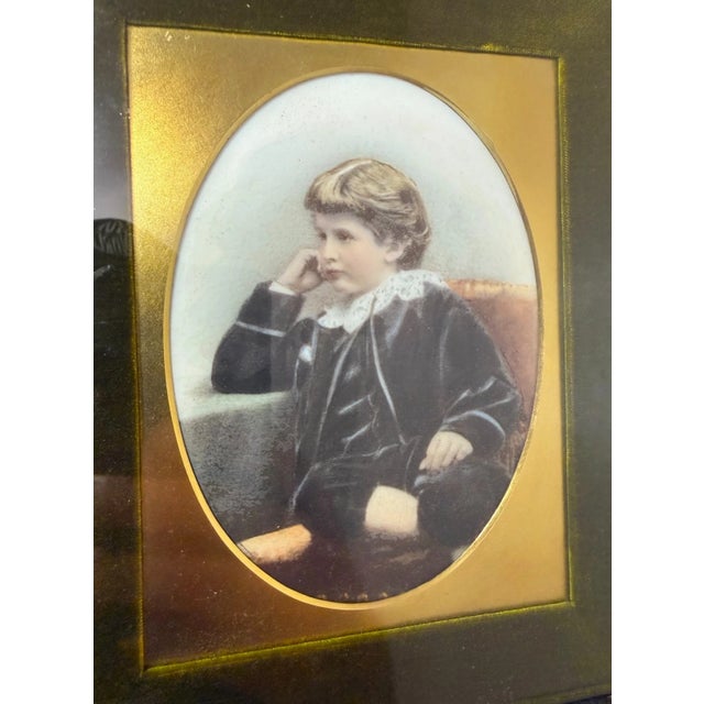 This antique miniature painting from the 19th century features a young boy and beautifully painted on porcelain. The...