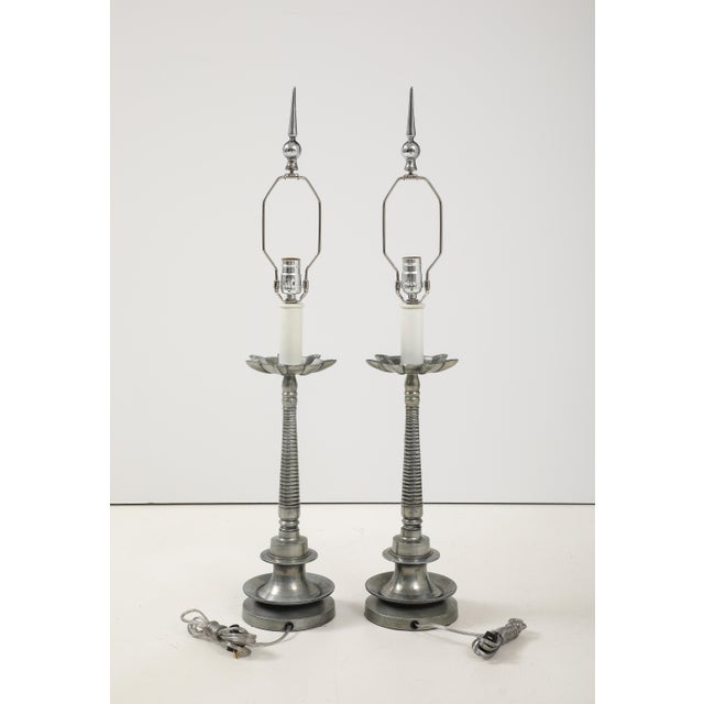 1970's modern French aluminum table lamps with original finial, in vintage condition newly rewired and ready to use, with...
