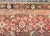 A stunning early 20th century Persian Meshkabad rug with an all-over floral pattern containing myriad large-scale flowers,...