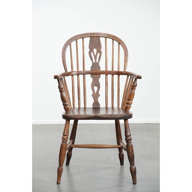 This beautiful antique Windsor dining chair has developed a wonderful patina over the years. This chair has a slatted...