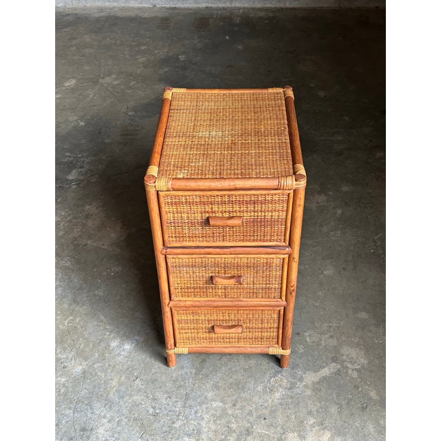 A versatile small three drawer chest / nightstand in the British colonial style. Compromised of bamboo skeleton and cane...