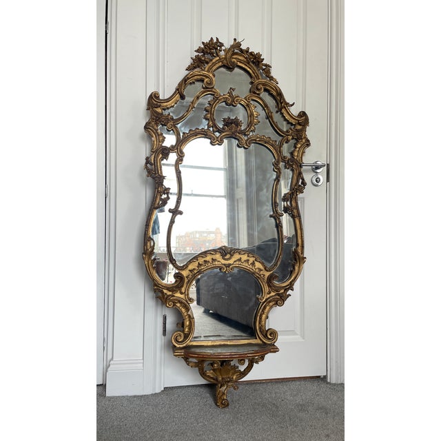 19th Century Rococo Revival Gilt Overmantel Mirror with Shelf A highly decorative mid–late 19th century Rococo Revival...