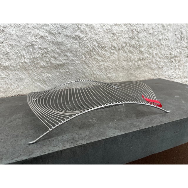 Futuristic metal frame wired fruit basket designed by Platt & Young for Auerhahn, Germany. The basket retains it original...