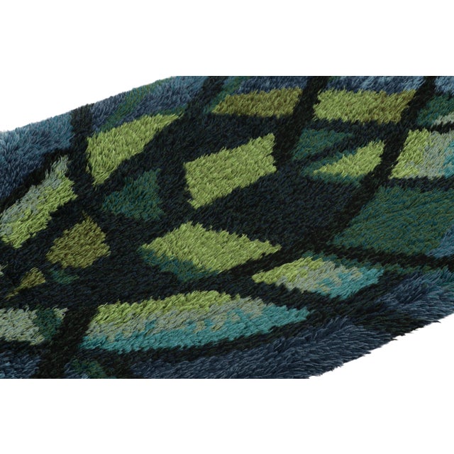 Hand-knotted in lush, high-pile wool in Sweden circa 1960-1970, this 3x5 vintage Swedish Rya rug is a bold new addition to...