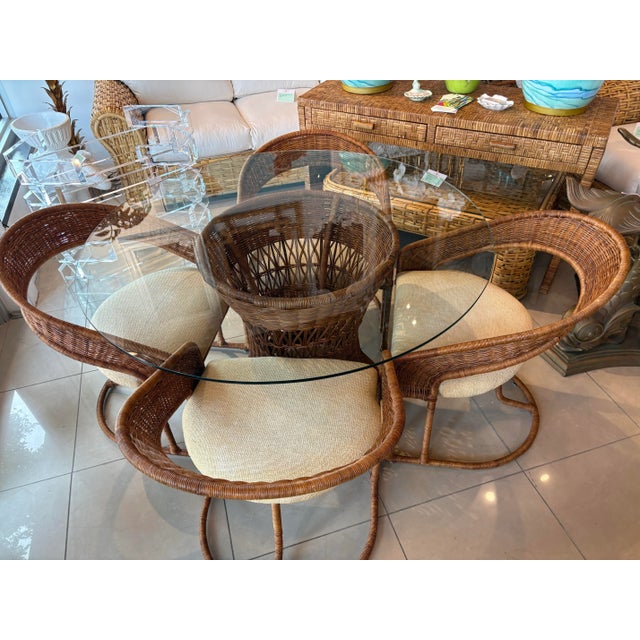 Vintage 5 piece rattan wicker dining table or game table dining set. Includes 4 barrel cantilever chairs, 1 dining base...