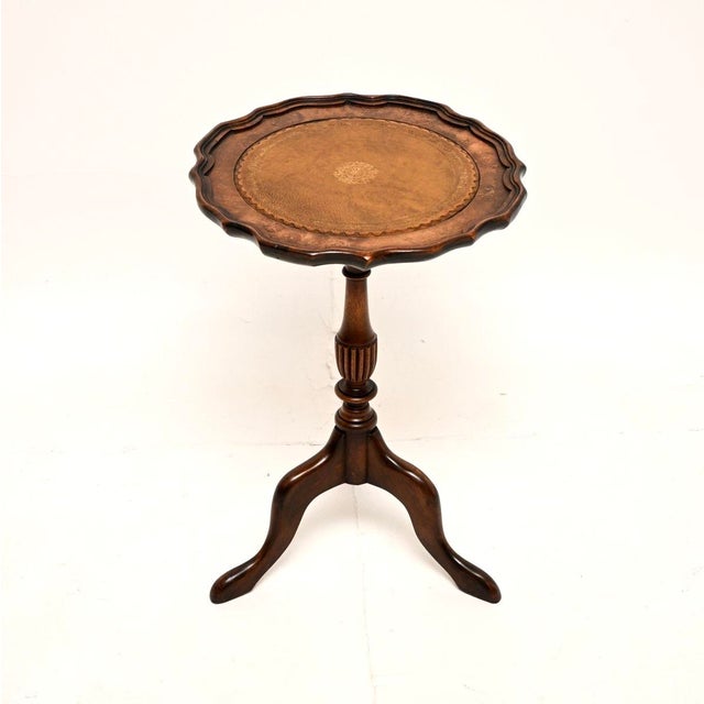 A smart and very useful vintage Georgian style burr walnut leather top wine table. This was made in England, it dates from...