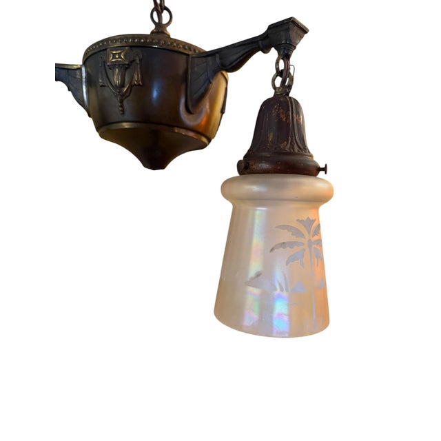 Such a great chandelier for any style home. Fabulous etched frosted iridized glass shades. Brass and bronze chandelier has...
