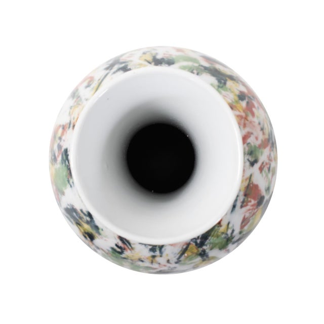 Elevate your home decor with this exquisite white vase, each adorned with sporadic bursts of color in refreshing shades of...