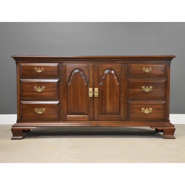 A six drawer solid cherry traditional dresser with brass batwing drawer pulls and dovetail drawers made by Pennsylvania...