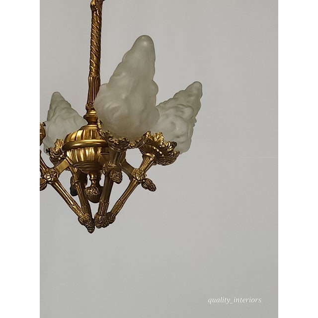 Offered for your consideration is an Antique Darling 4 Arm 4 Light Glowing Ribbons and bows Flame Torch Chandelier. The...