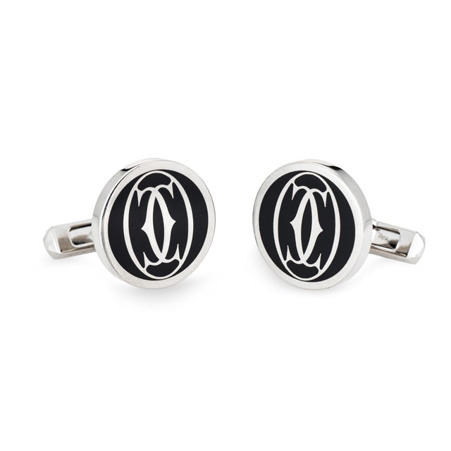 Pre-owned C de Cartier cufflinks crafted in sterling silver. The stylish cufflinks feature the double C de Cartier motif...
