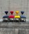 A vibrant and sculptural set of four postmodern dining chairs in richly upholstered suede with polished chrome bases....