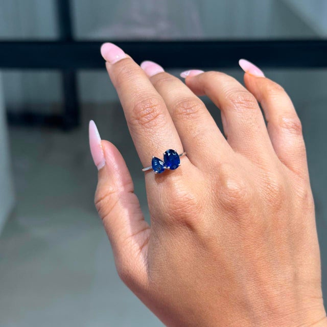 This Toi et Moi Ring showcases a 2.55 carats of natural blue sapphires, set in 14K White Gold. The oval cut sapphire...