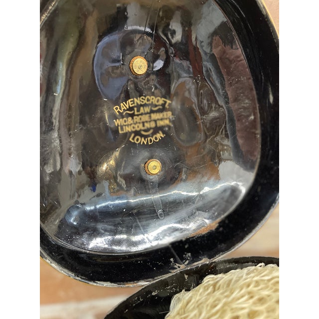 This interesting piece of English law is a barrister wig in its original Ravenscroft Law toleware box.=, which holds the...