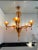 Contemporary translucent orange murano glass chandelier in deco' style decorated in translucent orange colour which makes...