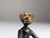 This exceptional and rare monkey sculpture is made of patinated and partially polished bronze, attributed to the renowned...